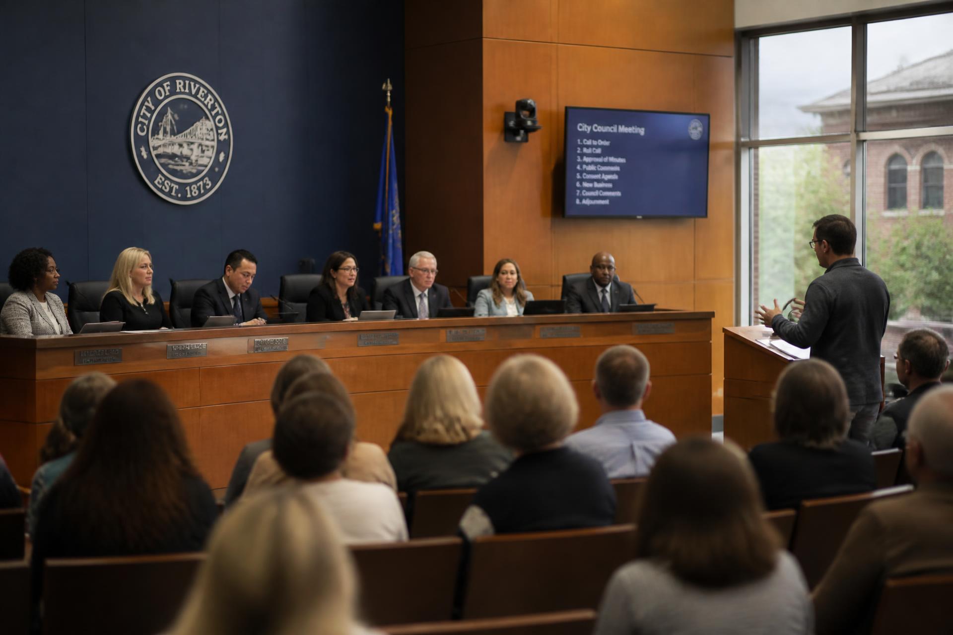 Residents and council members at a city council meeting